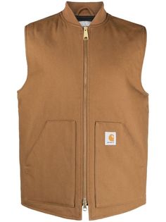 A signature Carhartt WIP style, the classic Vest is constructed in hardwearing Dearborn Canvas. Cut in a regular fit, the garment is also diamond-quilted and lined with nylon taffeta. A kangaroo pocket, rib-knit collar, and front zipper complete the design.Gender: MenMaterial: 100% COTTONColor: BrownMade in: ImportedProduct ID: I01525103 HZ01 HAMILTON BROWN RIGID*Import tax/duty will be calculated at checkout (If applicable) Canvas Vest, Carhartt Work In Progress, Carhartt Workwear, Relaxed Outfit, Jeans Casual, Outerwear Vest, Carhartt Wip, Cotton Logo, Look Plus