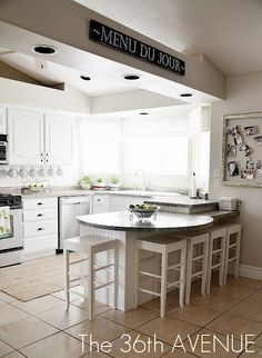 the kitchen is clean and ready to be used for cooking or baking, with all white appliances