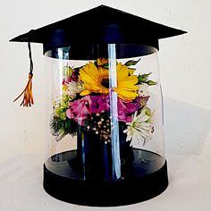 a graduation cap with flowers in it