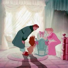 an animated image of a man and woman with a child in front of a bed