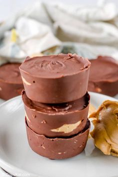 three chocolate desserts stacked on top of each other