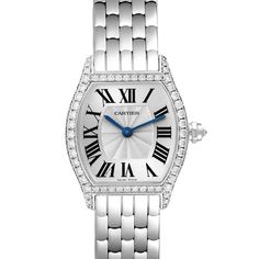 Cartier Tortue White Gold Diamond Ladies Watch WA501011. Manual winding movement. 18K white gold case 24.0 x 30.0 mm. Octagonal crown set with the diamond. Diamond lugs. 18K white gold bezel with factory Cartier diamonds. Scratch resistant sapphire crystal. Silver dial with Roman numerals. Blue sword shape hands. Secret signature at VII. 18k white gold bracelet with double deployant hidden clasp. Fits 6 1/4" wrist. Cartier Diamond Watch With Round Dial, Cartier Diamond Watch With Diamond Accents, Timeless Diamond Watch With Metal Dial For Anniversary, Timeless Diamond Watch For Anniversary, Classic Silver Diamond Watch With Diamond Hour Markers, Formal Diamond White Watch With Metal Dial, Classic Diamond White Watch With Metal Dial, Timeless Cartier Diamond Watch In Platinum, Cartier Silver Diamond Watch With Brilliant Cut