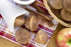 cinnamon sugar donuts and apples on a table