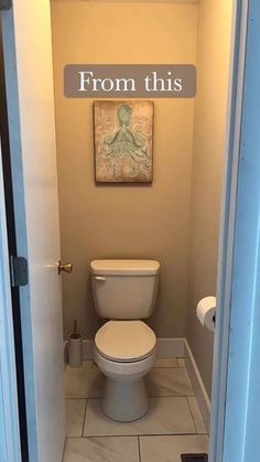 a white toilet sitting inside of a bathroom next to a doorway with a sign above it