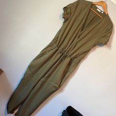 Green Xxl Relaxed Fit Cotton Jumpsuits And Rompers With Tie Waist, Relaxed Fit Cotton Jumpsuit With Tie Waist, Cotton Jumpsuit With Tie Waist And Relaxed Fit, Short Sleeve Stretch Jumpsuits And Rompers With Pockets, Cotton V-neck Jumpsuit For Work, Spring Khaki Jumpsuits And Rompers Relaxed Fit, Spring Khaki Relaxed Fit Jumpsuits And Rompers, Green Cotton V-neck Jumpsuit, Green V-neck Cotton Jumpsuit