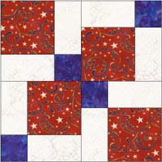 a red, white and blue patchwork quilt with stars in the center on it