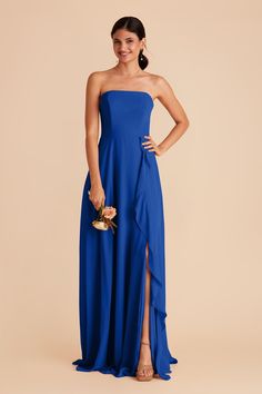 a woman in a blue strapless dress