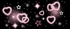 some pink hearts and stars on a black background