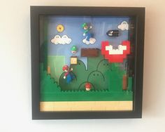 an image of a nintendo game being displayed in a frame with legos on it