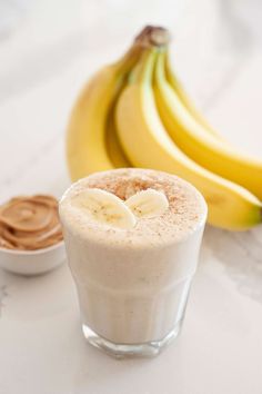 a banana and some kind of drink on a table