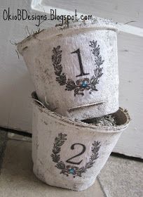 two buckets with numbers on them sitting next to each other