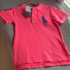 Truly A One Of A Kind. Nwt Ralph Lauren Polo Shirt. A Vibrant Neon Pink/Orange With A Royal Blue Large Pony Decal. Royal Blue ‘3’ On Sleeve. Show Stopping. Feel Free To Bundle With Others Alike. Happy Poshing! Fitted Pink Polo Shirt With Short Sleeves, Playful Pink Cotton Shirt, Pink Ralph Lauren Shirt For Summer, Ralph Lauren Pink Summer Shirt, Ralph Lauren Pink Spring Shirt, Ralph Lauren Pink Shirt For Spring, Ralph Lauren Pink Shirt For Summer, Pink Fitted Polo Shirt For Spring, Fitted Pink Polo Shirt For Spring