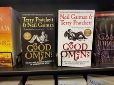 there are many books on the shelf in the library, one is for good omens