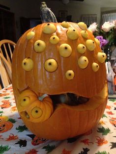 there is a pumpkin with holes in the middle and eyes on it's face