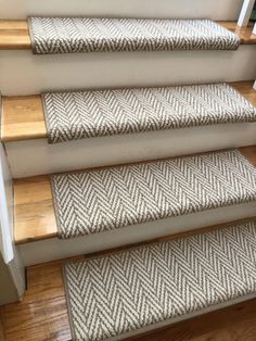 a set of stairs with carpeted treads