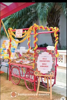 a red cart with some food on it