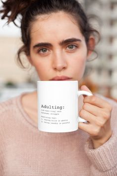 a woman is holding a coffee mug with the words, you're never too old