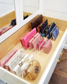 the purses are lined up on the counter in the store's dressing room