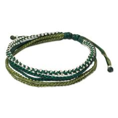 Thailand's Napapat selects fresh shades of green for the design of this cord bracelet. Braided by hand the five strand wristband is dotted with luminous silver accents. .950 Silver Green Friendship Bracelets With Sliding Knot, Green Beaded Wrap Bracelet, Adjustable Green Beaded Wrap Bracelet, Adjustable Green Beaded Bracelets With Sliding Knot, Adjustable Green Beaded Braided Bracelet, Adjustable Green Braided Beaded Bracelets, Green Multi-strand Adjustable Beaded Bracelets, Green Beaded Bracelets With Adjustable Cord For Friendship, Adjustable Green Multi-strand Beaded Bracelets