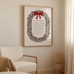 a christmas wreath is hanging on the wall next to a chair