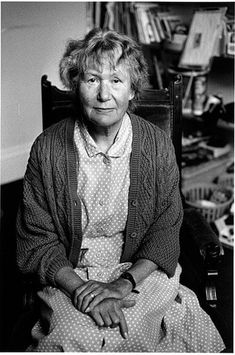 black and white photograph of an older woman sitting in a chair