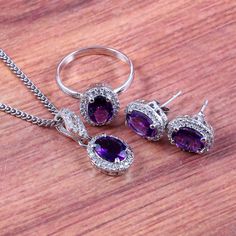 "This Sterling Silver Jewelry set features an Elegant Art With Natural Amethyst Gemstone. The cavity is made from genuine solid 925/92.5 Sterling silver and stamped as S925. This Jewelry is Lead free and Rhodium plated to prevent scratches and tarnish. ITEM DESCRIPTION Item Code: JACB58 Metal: 925/92.5 Sterling Silver Gemstone: Genuine Natural Amethyst Gemstone Shape: Oval Gemstone Size: 6X8 MM Surrounded Tiny Stones: Zircon Ring Dimension:- Length: 11 MM Width: 9.5 MM Weight: 2.29 gm approx Ear Smokey Topaz Ring, Halo Art, Silver Jewelry Set, Necklace Matching, Bridal Jewelry Set, Silver Anniversary, Silver Jewellery Sets, Earrings Pendant, Matching Jewelry