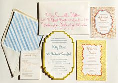 the wedding stationery is laid out neatly on top of each other, including cards and envelopes