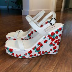 Brand New Strawberry And Berry Patterned Wrap Wedge Heel. -4.5’ Heel, 1” Platform -Open Toe -Ankle Buckle Closure Color: White/Red Berry Print White Heels With Red Sole For Spring, High Heel Synthetic Wedge Sandals With Red Sole, Spring Wedge Sandals With Red Sole, Trendy White Wedge Sandals, White Wedge Sandals With 4-inch Heel For Spring, Spring Wedge Heels With Red Sole, Spring Red-sole Wedge Heels, White Wedge Sandals With 4-inch Heel For Summer, White Synthetic Wedge Sandals With 4-inch Heel