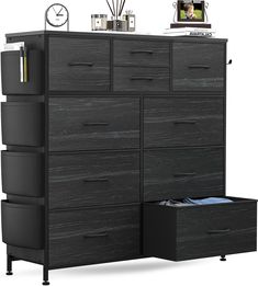 a black dresser with drawers and a clock on the top shelf next to an open file cabinet