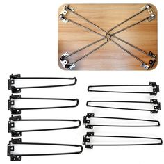 six pairs of black metal handles on a wooden board