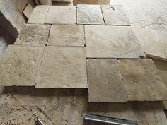 several pieces of tile laying on the floor