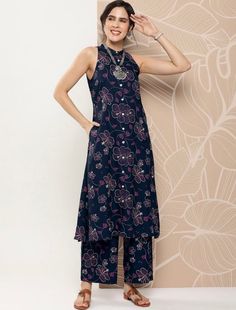 * Women Band Collar Floral Printed A-Line Kurta with Palazzos Indian Party Wear For Women / Indian Wedding Wear / Indian Plus Size Dress For Women / Customisation Available Silk Kurta Sets - Pakistani Salwar Kameez Set - Tunic Top * Navy blue printed Kurta with Palazzos * Kurta design:- * Floral printed * A-line shape * Regular style * Band collar, sleeveless * 1 pockets Calf length length with curved hem * Viscose rayon fabric * Button closurePalazzos * Palazzos design:- * Printed Palazzos * Pa Casual Sleeveless Floral Print Sets, Casual Sleeveless Sets With Floral Print, Sleeveless Multicolor Sets With Printed Motifs, Multicolor Sleeveless Sets With Printed Motifs, Bohemian Sleeveless Festive Sets, Bohemian Festive Sleeveless Sets, Casual Sleeveless Printed Sets, Festive Bohemian Sleeveless Sets, Multicolor Printed Sleeveless Sets