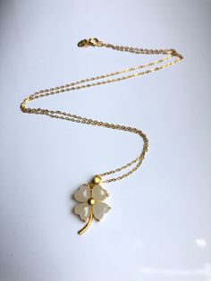 A piece of charming & cute white jade necklace, which is made with genuine 100% natural real white jades and 14k gold plated necklace. A great combination of modernness and elegance. The simple and lovely lucky clover design adds a spark to your daily wear or a bit of charm for your fun dating night. Perfect as a gift for your loved ones or yourself, and to wish them GOOD LUCK! Some Highlights of this piece 18'' white lucky Chinese jade pendants are: ＊High-quality Material Only 100% natural Elegant White Jade Jewelry, Elegant White Jewelry For Good Luck, Handmade White Jade Necklaces, White Jade Jewelry For Wedding, White Pendant Necklace For Good Luck, White Flower Pendant Necklace For Anniversary, White Clover, Clover Design, Chinese Jade