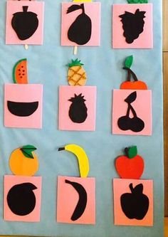 a bulletin board with cut out fruits and vegetables