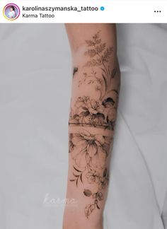 a woman's arm with flowers on it