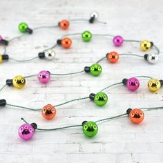 a string of colorful beads with eyes on them