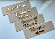 three metal name tags with arrows pointing to each other and the words last room, treatment room, treatment room, reception room 3