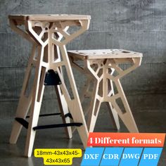 two wooden stools sitting next to each other