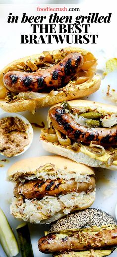 hot dogs and other food items on a white tray with the words, my husband loves these bratwurst in beer wth onions