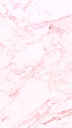 a pink marble textured surface that looks like it could be used as a background