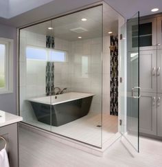 a bath room with a tub a sink and a mirror on the wall in it