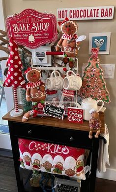 a table topped with lots of different types of christmas decorations and cookies on top of it