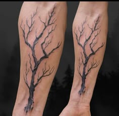 two bare branches on both legs are shown in this tattoo art photo by artist mark smith