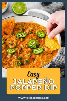 someone dipping tortilla chips into a bowl of jalapeno popper dip