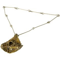 This hand wrought brass necklace features an abstract pendant constructed in fairly high relief for the scale. It has torch cut edges, accents of oxidation, and a kind of architectural, weblike structure. It hangs from a chain of long, wire links. It's like wearing a little modern sculpture around your neck. approximate measurements: overall length- 15" pendant- 3" wide x 1 1/8" deep x 3 1/2" high chain drop is 11 1/2" to the top of the pendant Please contact us if you have any questions. Sculptural Necklace, Victorian Pendant Necklace, Italian Necklace, Sapphire Diamond Pendant, Abstract Pendant, Gold Link Necklace, Victorian Pendants, Gold Link Chain, Sterling Necklaces