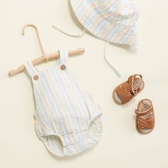 Product Details Summer stripe romper with coconut buttons Adjustable button hole straps Button snaps Elastic around leg 49% Organic Cotton, 51% Linen Machine wash gentle cycle Summer Cotton Bubble Romper With Button Closure, Spring Cotton Bubble Romper With Button Closure, Linen Romper, Button Hole, Summer Stripes, Organic Cotton Baby, Striped Rompers, Stay Cool, Baby Romper