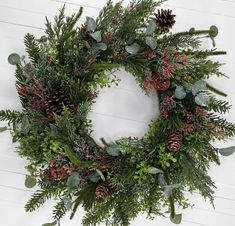 This rustic mixed pine winter wreath will look amazing on your door all winter long! The evergreen and berry mix is a classic look that fits with any home decor.  The simple styled winter pine wreath is made with a large variety of high quality faux evergreen, red berries, and pinecones. The wreath is ~4" deep and will fit nicely behind a storm door. Wreath Measurements: 20"W x 20"H x 4"D READY to 📦and 📬to your home today! **FREE SHIPPING IS OFFERED FOR LOWER 48 US STATES ONLY** 💕 I use high Branch Wreaths, Front Door Rustic, Wreath Workshop, Pine Doors, Traverse City Mi, Evergreen Wreath, Christmas Tree Branches, Work Wreath, Pine Wreath