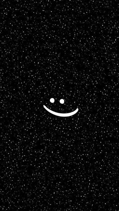 a black and white photo with two smiley faces on it's face in the dark