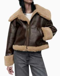 Material : Made from high-quality faux shearling and leather for a stylish and warm look. Design : Classic A-2 bomber style with a sleek brown finish that complements various outfits. Comfort : Soft faux shearling lining provides warmth and comfort during colder months. Versatility : Suitable for casual and semi-formal occasions, easily paired with jeans, skirts, or dresses. Details : Features ribbed cuffs and hem for a snug fit, along with a zippered front for easy wear. Winter Shearling Leather Jacket With Zipper, Winter Shearling Leather Jacket With Zipper Closure, Winter Brown Leather Jacket With Padded Collar, Brown Leather Jacket With Padded Collar For Winter, Brown Fur Coat With Zipper For Fall, Brown Winter Biker Jacket With Zipper Closure, Brown Biker Jacket With Zipper For Winter, Fall Brown Biker Jacket With Padded Collar, Casual Brown Sheepskin Outerwear