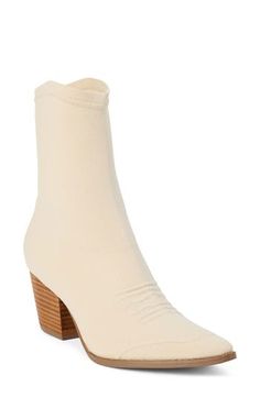 A pointy toe, Cuban heel and curvy topline reflect the Western-influenced design of this ankle boot made with a stretchy knit upper. 2 1/2" heel; 1/2" platform 8" shaft Pull-on style Textile upper/synthetic lining and sole Imported Fitted Heeled Boots With Sculpted Heel For Fall, Cream Pointed Toe Fitted Boots, Fitted Cream Boots With Pointed Toe, Fitted Cream Pointed Toe Boots, Fall Fitted Beige Heeled Boots, Beige Fitted Heeled Boots For Fall, Fitted Cream Heeled Boots For Winter, Fitted Beige Heeled Boots For Fall, Fitted Ankle Boots With Stacked Heel